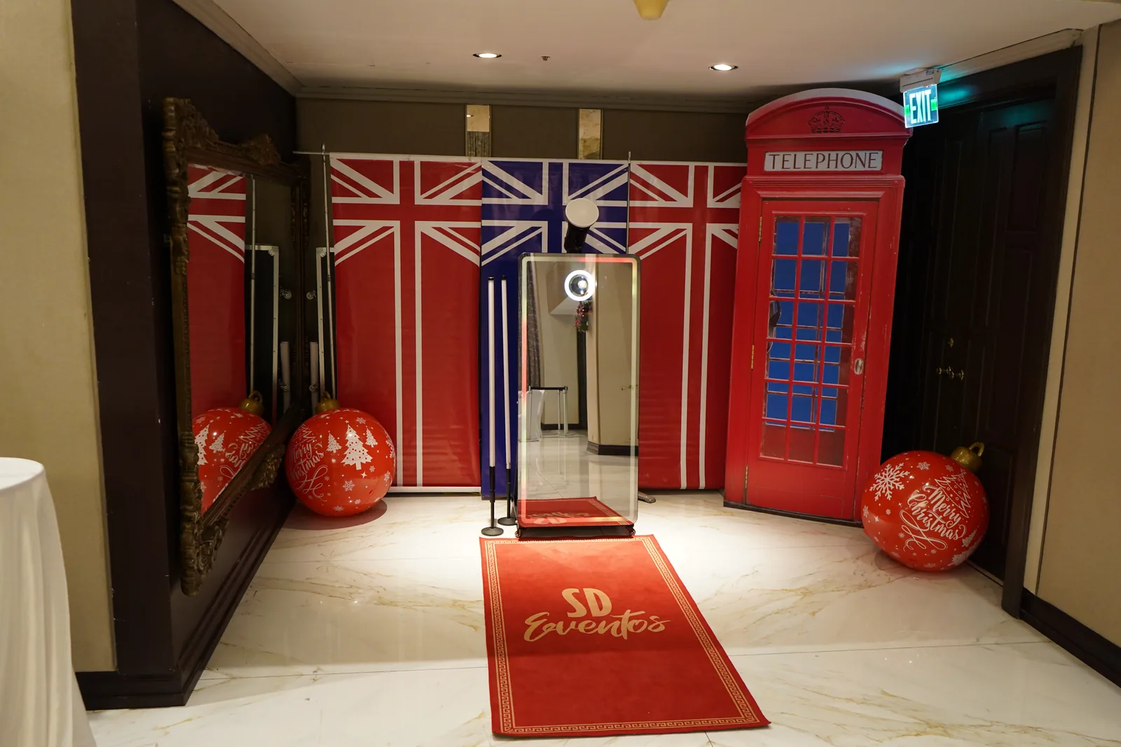 A red telephone box photo backdrop and "magic mirror" for portraits
